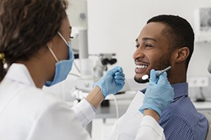 Man smiling at his sedation dentist in Fort Lauderdale